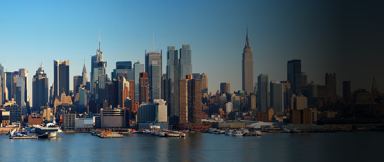 A city skyline with buildings in the background