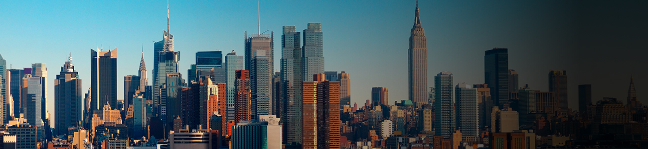 A city skyline with buildings in the background